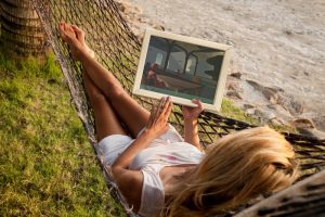 woman in hammock with tablet